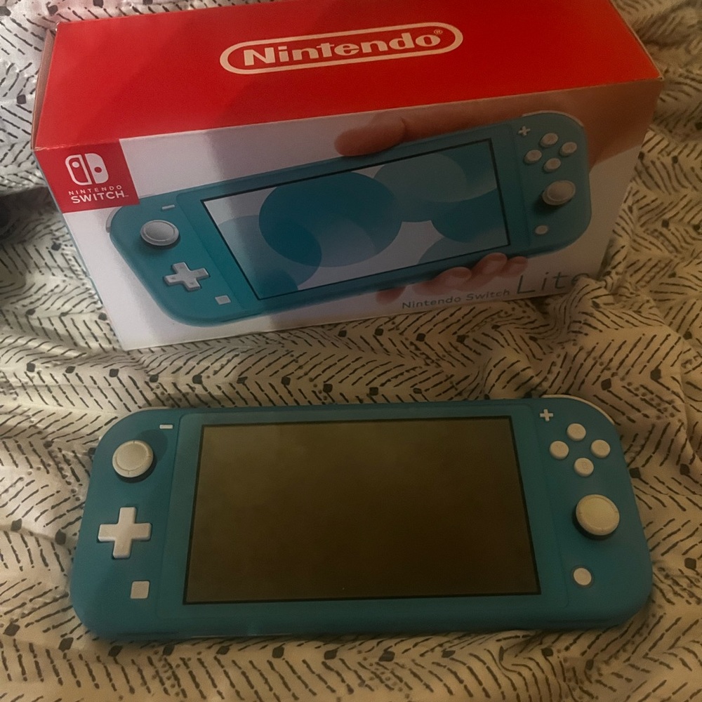 Nintendo Switch Lite Blue Console. With a memory card 2 games & zelda carrycase